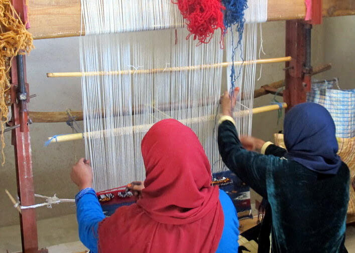 Morocco Carpet styles women at loom