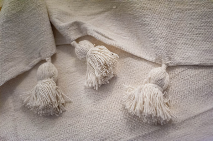 Golden White blanket with pom poms - Moroccan Rugs Blankets